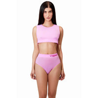a woman wearing a pink crop top and panty in pink