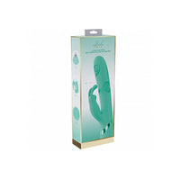 Green vibrator on packaging on a white background