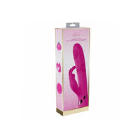Pink vibrator in packaging on a white background