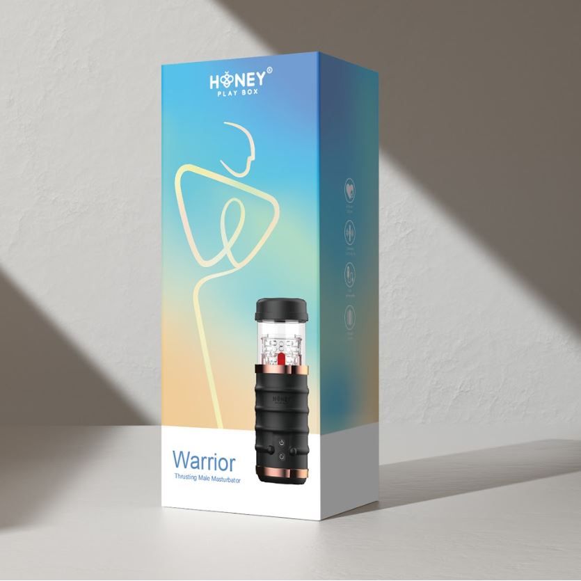 The retail packaging box for the HONEY PLAY BOX Warrior Thrusting Head Masturbator, featuring a blue-to-yellow gradient design with a white base and a graphic of a stylized figure.