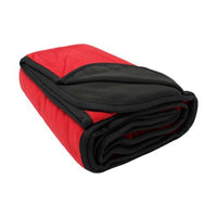 Folded red and black blanket on a white background