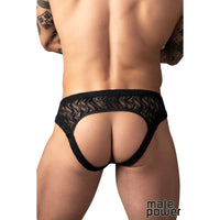 male wearing black wavy jock strap on white background