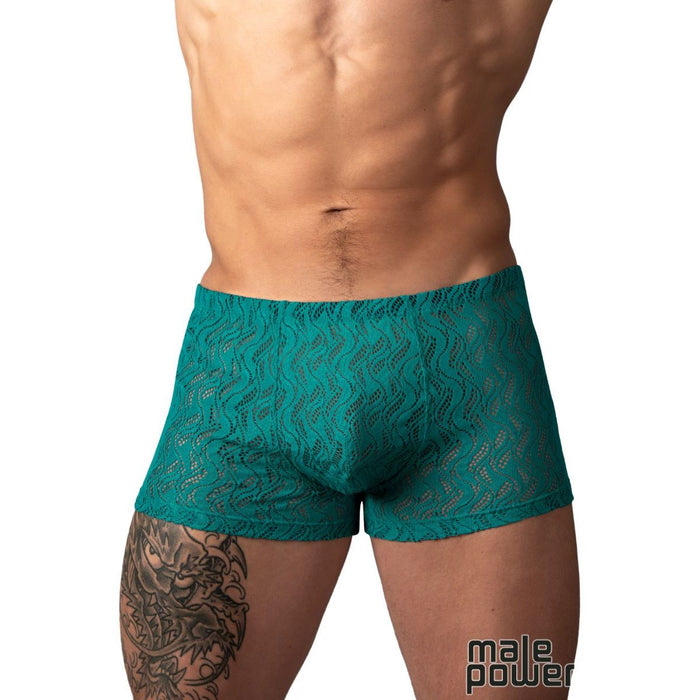 A close-up of a male model's lower torso wearing teal lace boxer briefs against a plain white background. The brand name 'male power' is visible as a watermark in the bottom right corner.