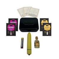 yellow vibrator, coconut pineapple body glide, love liquid body glide, oil of love massage oil, battery, metal tin box, and 3 playing cards