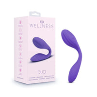 a purple internal external vibrator with vertical ridges on the clitoral end shown next to its pink display box