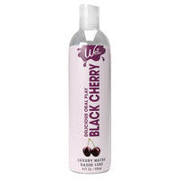 clear bottle with white wrapper and purple writing black cherry flavored lubricant 4oz