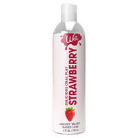 clear bottle with white wrapper and red writing strawberry flavored lubricant 4oz