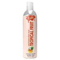 clear bottle with white wrapper and orange writing tropical fruit flavored lubricant 4oz