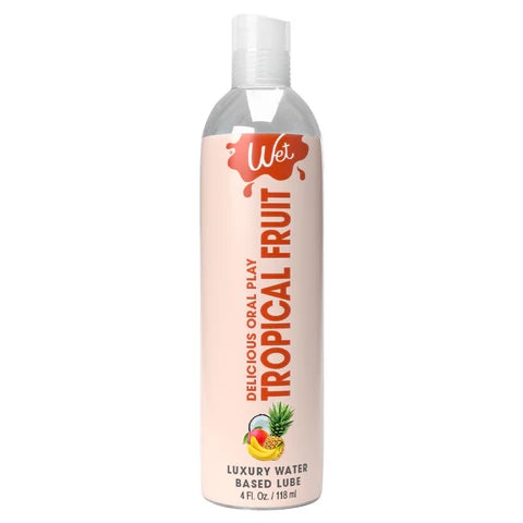 clear bottle with white wrapper and orange writing tropical fruit flavored lubricant 4oz