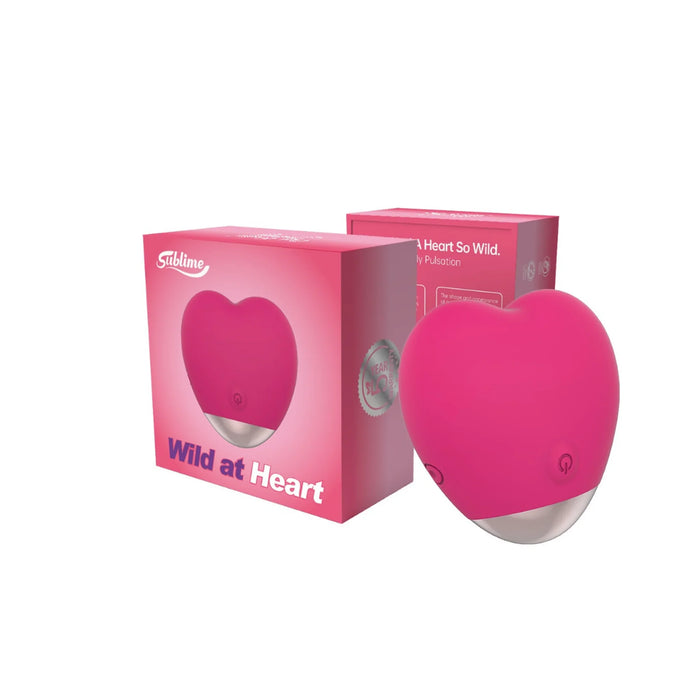 pink heart massager beside box