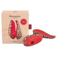 leopard and red womanizer liberty 2 vibrator beside packaging
