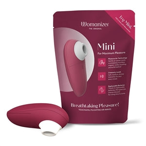 burgundy vibrator with white head beside package