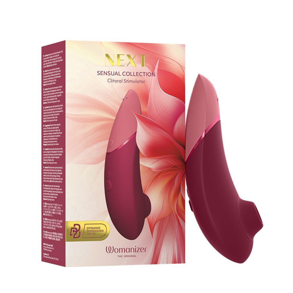 Womanizer clitoral stimulator with packaging on a white background