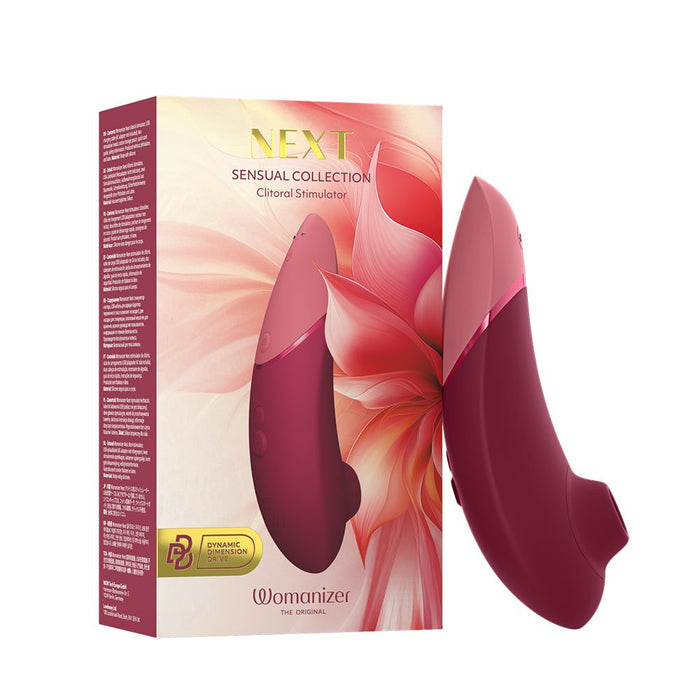 Womanizer clitoral stimulator with packaging on a white background