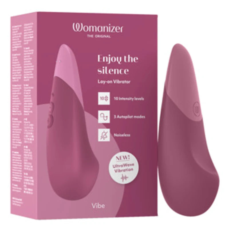 massager vibrator in pink beside box