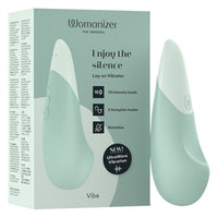 green sleek curved womanizer vibrator with green box