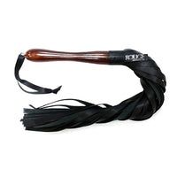 Black leather flogger with wooden handle on a white background, featuring the brand 'Rouge'.