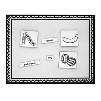 Educational magnetic board with black and white illustrations and words on a decorative border.