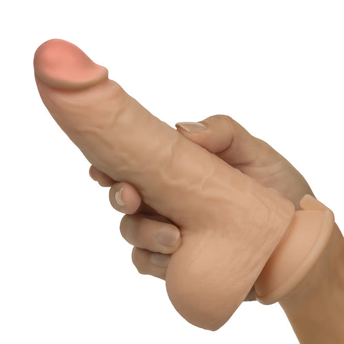 realistic dildo held in hand