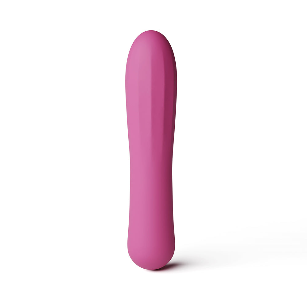 A pink silicone personal massager with a smooth, tapered design, standing vertically on a clean white background.