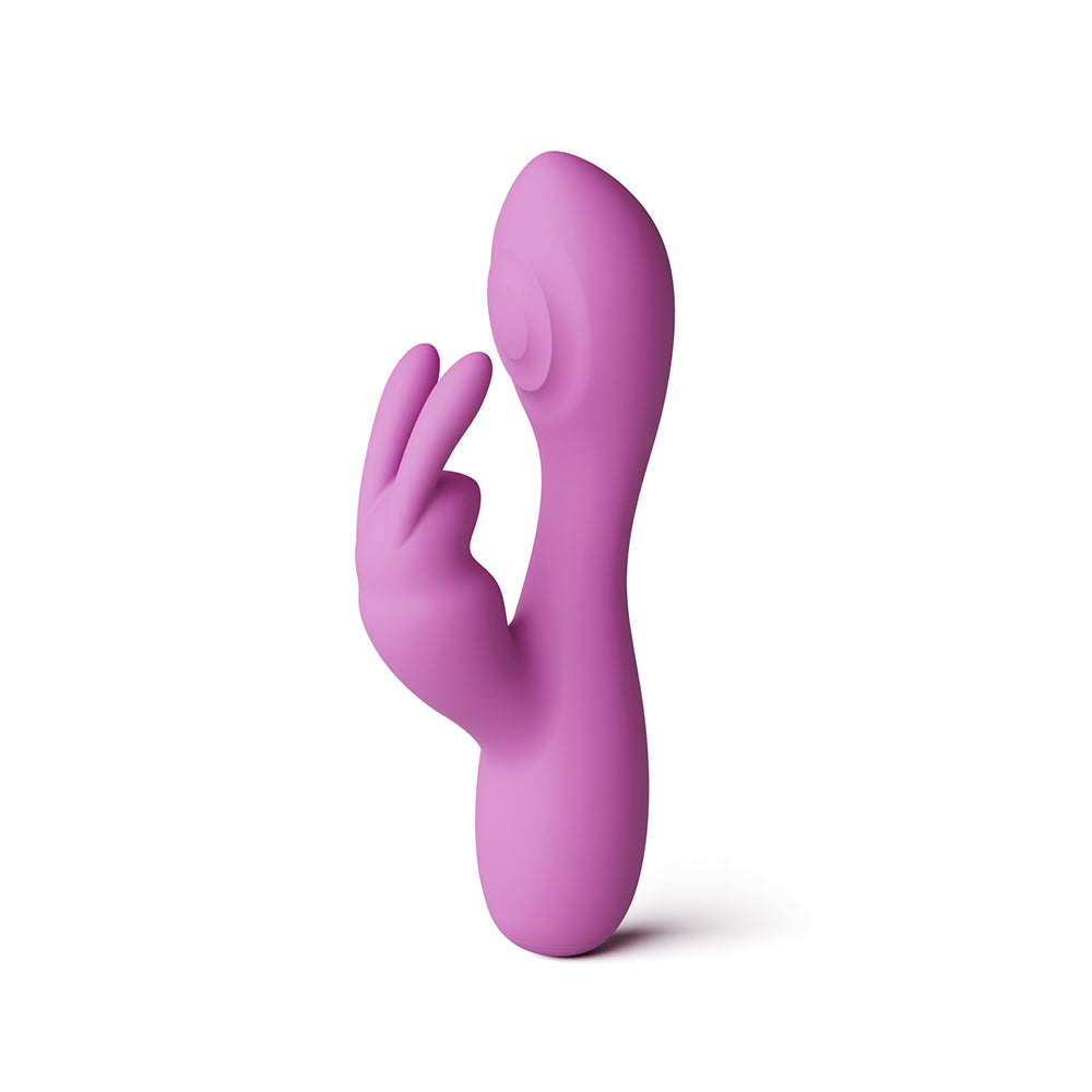 A pink silicone personal massager shaped like a stylized hand, standing upright on a plain white background.