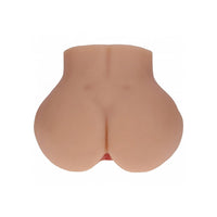 A realistic flesh-toned silicone butt toy with a realistic center crease and a small pink opening at the bottom, shown from the back on a solid white background.