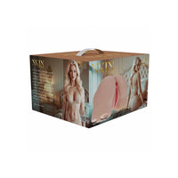 Xkin Beauty Suction Cup gift box, featuring a gold-colored top handle and sides with printed images of a blonde woman in lingerie and a clear view of the pink masturbator on the front.