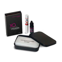 Collection of products including a box labeled 'XO Kisses & Orgasms' and a small bottle on a white background.