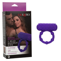 The image shows a purple silicone cock ring with raised beads, alongside its packaging. The box displays the product and indicates its features, including 12 vibration functions and waterproof design.