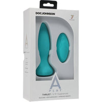 The image shows the product packaging for the Doc Johnson A-Play Thrust Vibrating Anal Remote Control. The box is predominantly white with a clear window displaying the blue silicone anal plug and the remote control.