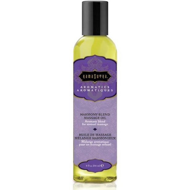 A bottle of Kama Sutra Aromatic Massage Oil in Harmony Blend with a purple label.