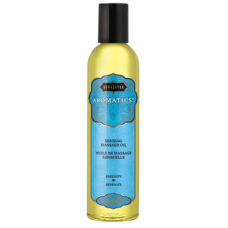 A bottle of Kama Sutra Aromatic Massage Oil with a label showing the brand and 'Serenity' as the scent, placed against a plain background.