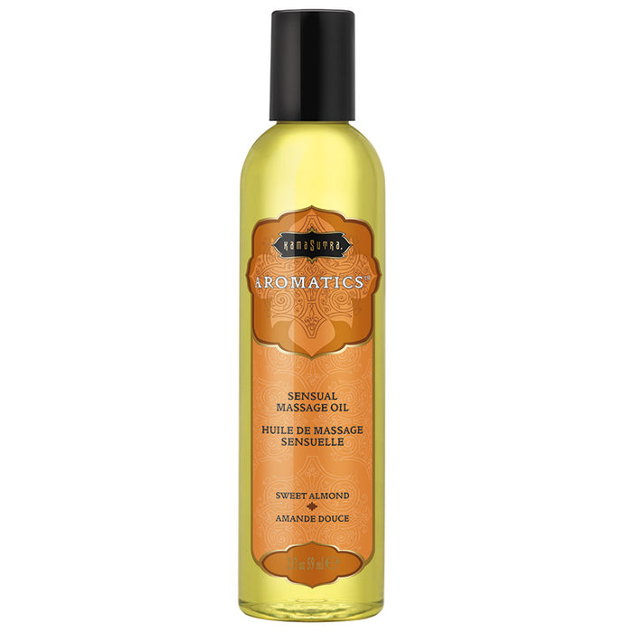 A bottle of Kama Sutra Sweet Almond Aromatics Massage Oil with a label showing the brand name and product details.