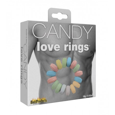 The image shows the packaging of the Candy Cock Ring's 3pk by Hott Products. The package displays a graphic of a male torso with multiple colored candy rings worn around the penis.