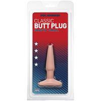 The product is a small, smooth, tear-drop shaped butt plug with a wide base, packaged in a clear plastic case. The background is red with white stars.