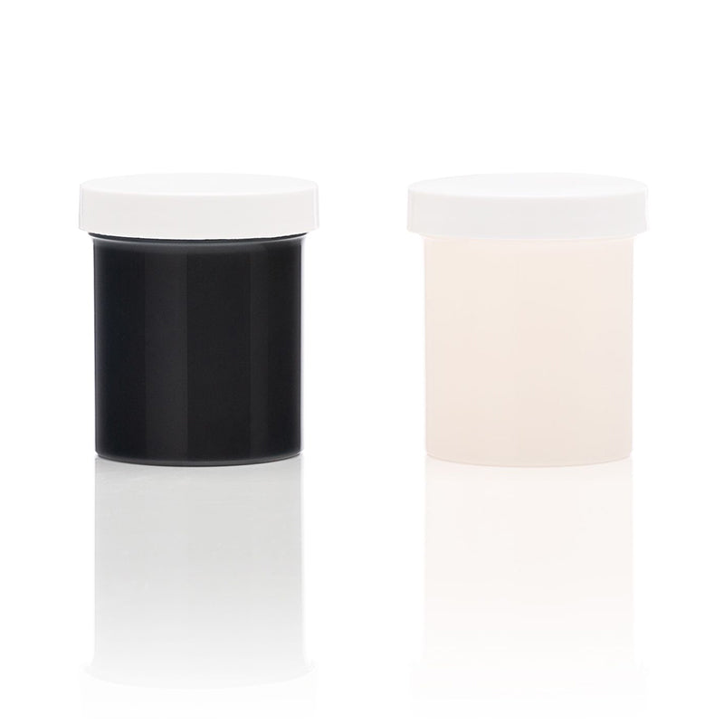 Two containers of liquid silicone refill, one black and one white, on a reflective surface.