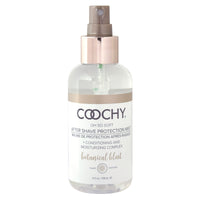 A bottle of Coochy After Shave Protection Mist with a spray dispenser, labeled 'botanical blast'. The bottle is clear with a white liquid visible inside, and it has a beige label with black and green text.