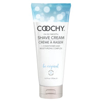 A tube of Coochy Shave Cream with a label that has the product name and the phrase 'be original'. The tube is predominantly white with blue accents and text.