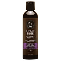 A bottle of Earthly Body Hemp Seed Body & Massage Oil in High Tide scent. The bottle is dark glass with a white and purple label.