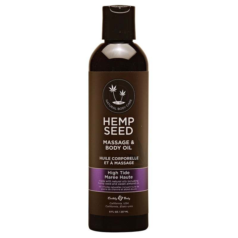 A bottle of Earthly Body Hemp Seed Body & Massage Oil in High Tide scent. The bottle is dark glass with a white and purple label.