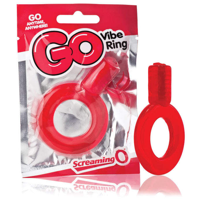 The image shows the Screaming O GO Vibrating Cock Ring in red color, packaged in a transparent plastic bag with red and white branding. The ring has a clear blue cylinder attached to a solid blue ring.