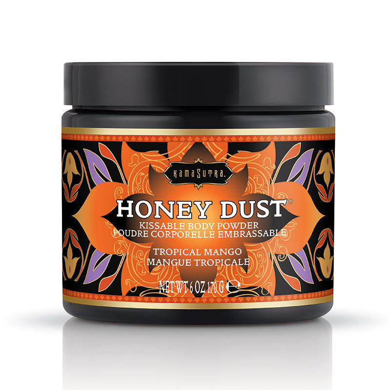 A container of Honey Dust kissable body powder with a Tropical Mango fragrance by Kama Sutra, featuring a colorful label with a floral pattern.