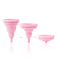 varying sizes of a menstrual cup on white background