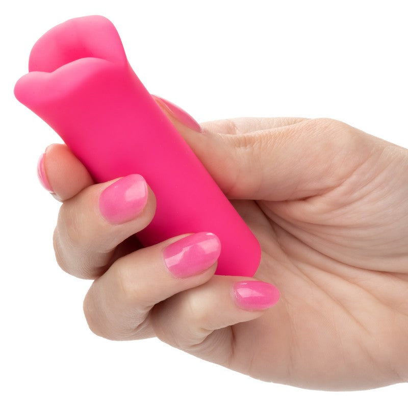 pink bullet with lips held in hand