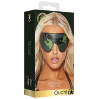 The product image shows the packaging of the Ouch Eye Mask Army, featuring a camouflage design. The packaging displays a model wearing the eye mask, emphasizing its stylish and military-inspired look.