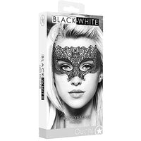 A black and white lace eye mask designed for adults, presented in packaging showing the mask on a female model wearing it over one eye, with the brand name 'Ouch!' displayed.