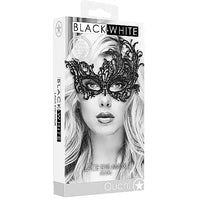 A black lace eye mask with intricate designs, displayed on a packaging that shows a monochrome image of a woman wearing the mask.