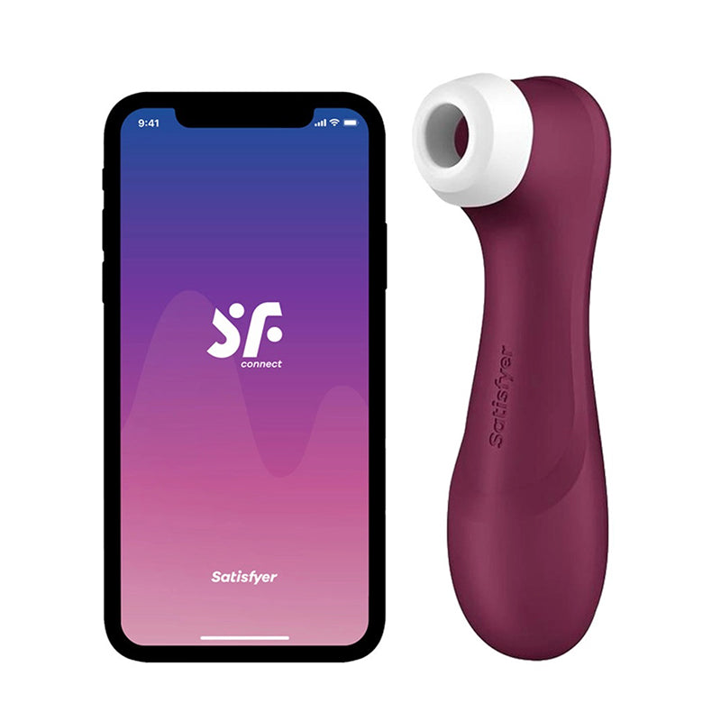 clitoral vibrator beside smart phone on white background