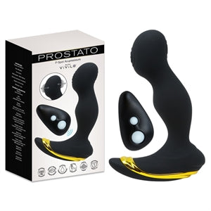 The image shows a black anal plug with a curved design, featuring a control button on its side. The product is displayed alongside its packaging, which includes a remote control.