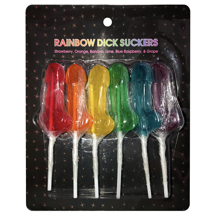 This image displays a pack of six Rainbow Dick Suckers, each lollipop crafted in the shape of a penis and presented in a variety of bright, multi-color hues. The lollipops are fruit-flavored, with flavors including strawberry, orange, banana, lime, blue raspberry, and grape, each clearly labeled on the packaging.